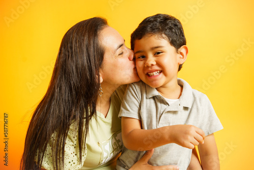 mom kissing her son