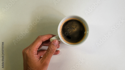 cup of black coffee on white table