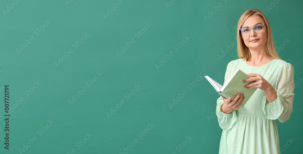 Beautiful woman reading book on green background with space for text Beautiful woman reading book on green background with space for text