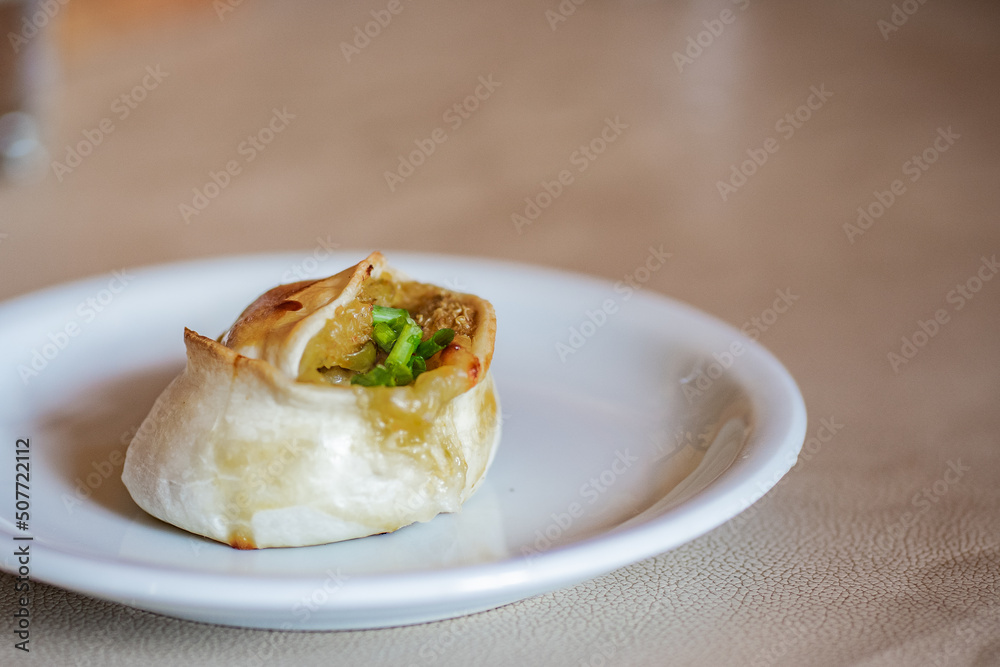 A typical baked Argentinian empanadas (similar to pie) with quinoa, cheese and green onion filling. Vegetarian food from Catamarca, Argentina. A typical baked Argentinian empanadas (similar to pie) with quinoa, cheese and green onion filling. Vegetarian food from Catamarca, Argentina.