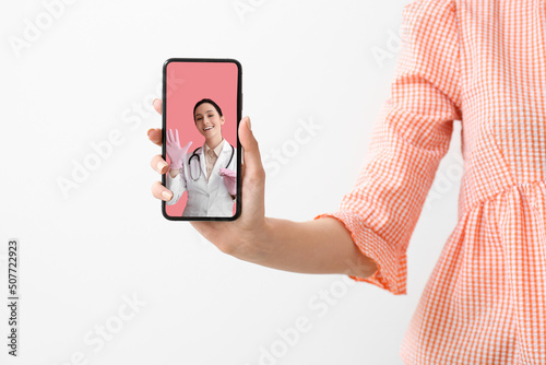 Woman holding smartphone wi...