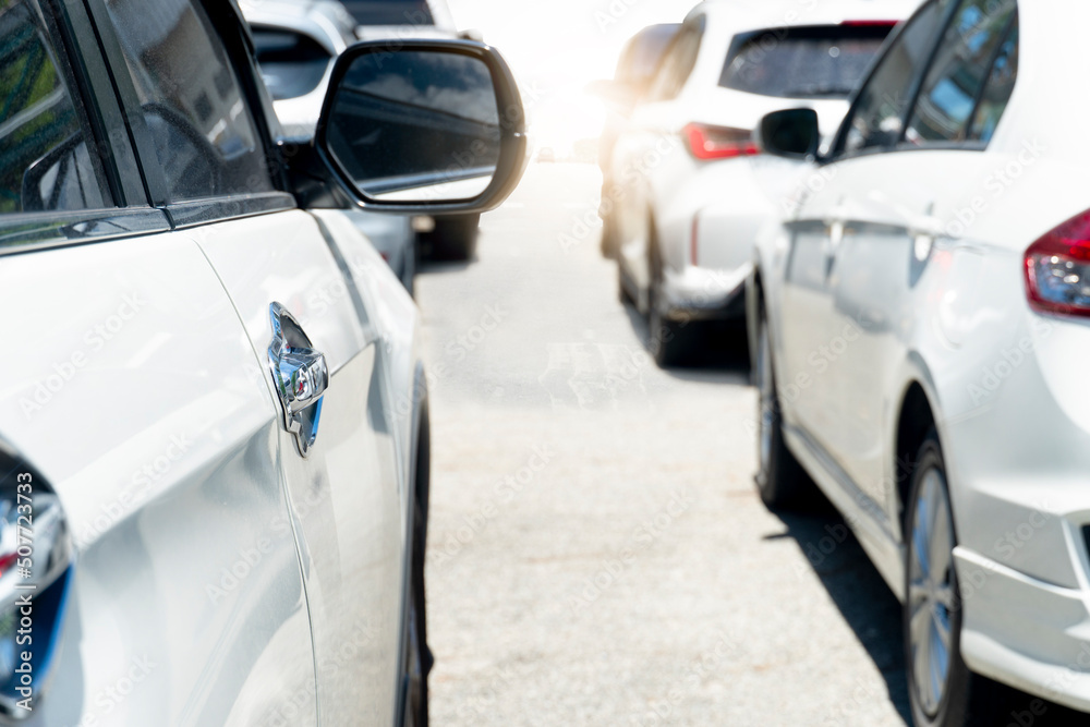 Beside of several vehicles line up on asphalt roads during traffic jams. Outdoor atmosphere during the day when the sun shines brightly. heading for the road ahead. Beside of several vehicles line up on asphalt roads during traffic jams. Outdoor atmosphere during the day when the sun shines brightly. heading for the road ahead.