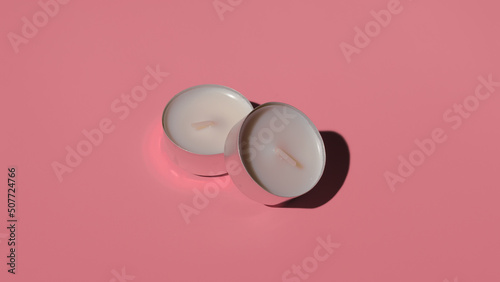 two unused candles on a colored background