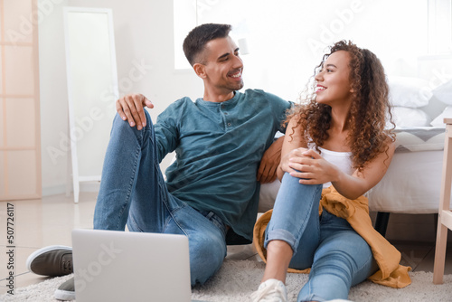 Young couple using modern l...