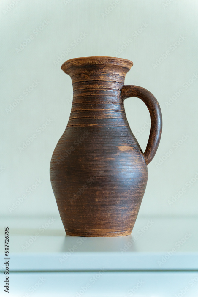   Ceramics, a ceramic product made with hands, made on a potter's wheel, a jug, a mug, clay.