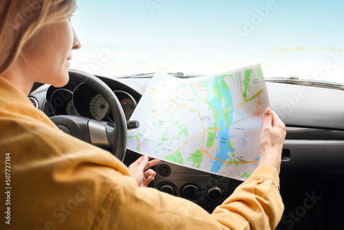 Female driver with city map...