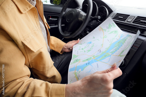 Female driver with city map...