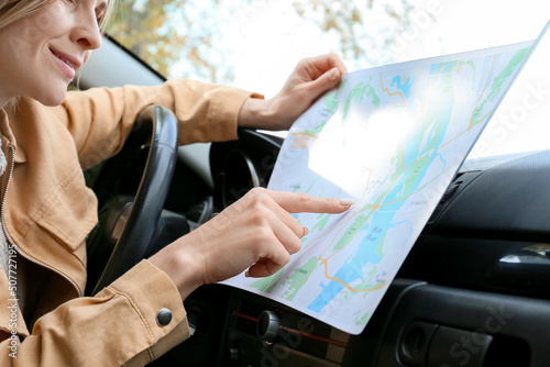 Female driver with city map...