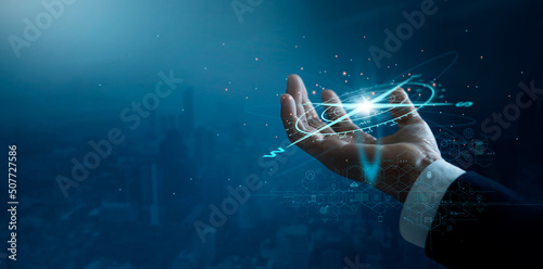 Фототапет Businessman holding compass of navigate on global economic crisis to resume business growth, Rethink, Reinvent and Recover, Investment,  banking and financial on blue city background