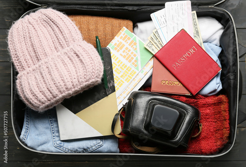 Open suitcase with guide's ...