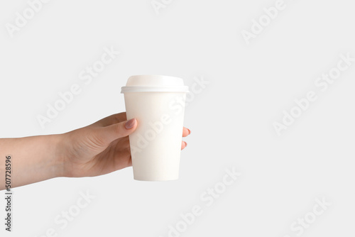 Woman holding takeaway pape...