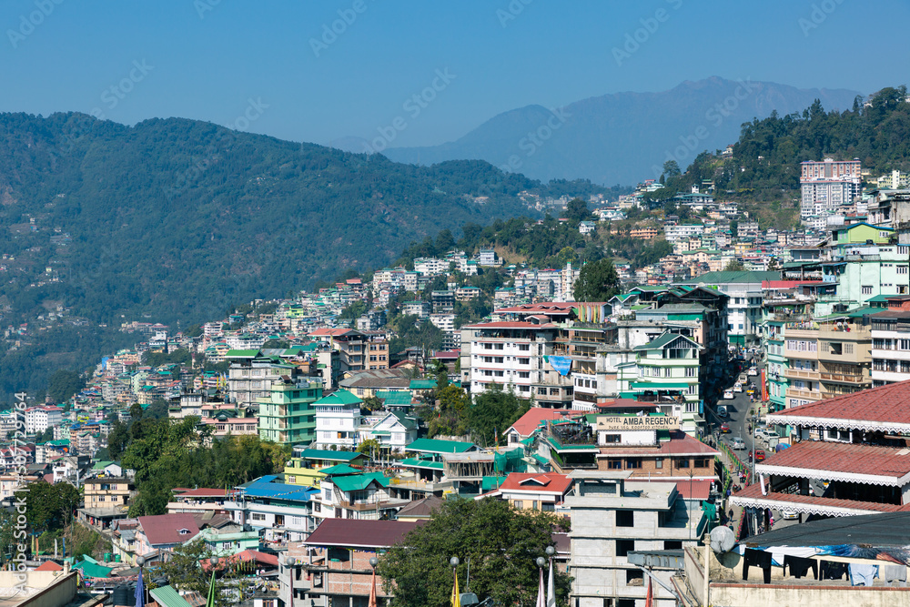 Gangtok, Sikkim, India - December 31, 2020 : Houses on the hill side in Gangtok, Sikkim, India. Gangtok, Sikkim, India - December 31, 2020 : Houses on the hill side in Gangtok, Sikkim, India.