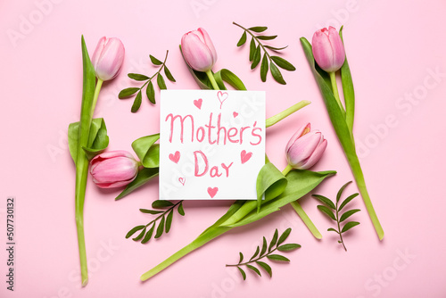 Card with text MOTHER'S DAY, tulips and plant branches on pink background