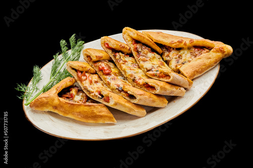 turkish vegetarian pizza pide on a black isolated background photo