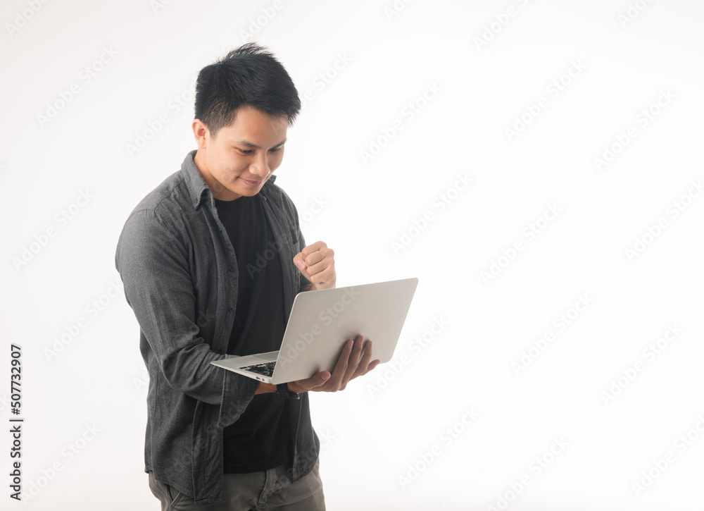 Photo of positive good young guy dressed brown cardigan typing modern device isolated white color background Photo of positive good young guy dressed brown cardigan typing modern device isolated white color background