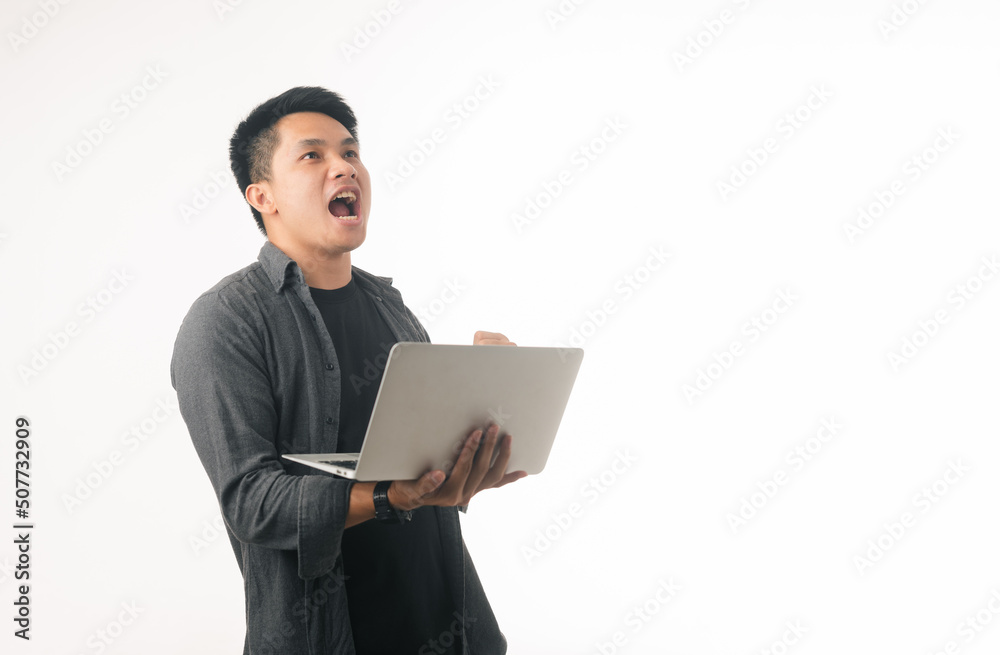 Photo of positive good young guy dressed brown cardigan typing modern device isolated white color background Photo of positive good young guy dressed brown cardigan typing modern device isolated white color background