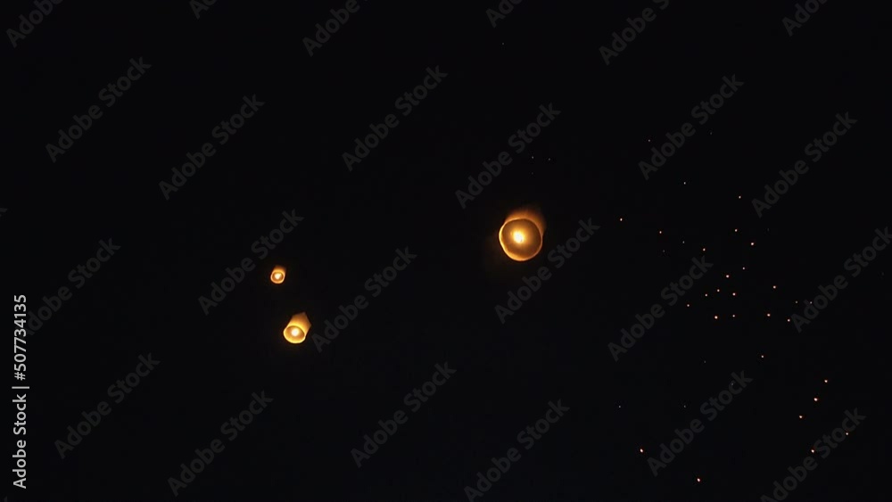Fire Lanterns Floating up into the sky at night at Loi Krathong Festival Travel Destinations Of Chiang Mai, Thailand Fire Lanterns Floating up into the sky at night at Loi Krathong Festival Travel Destinations Of Chiang Mai, Thailand