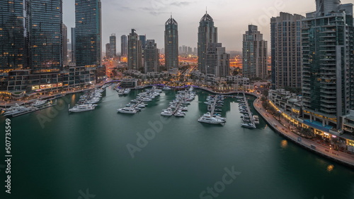 Luxury yacht bay in the city aerial night to day timelapse in Dubai marina © neiezhmakov