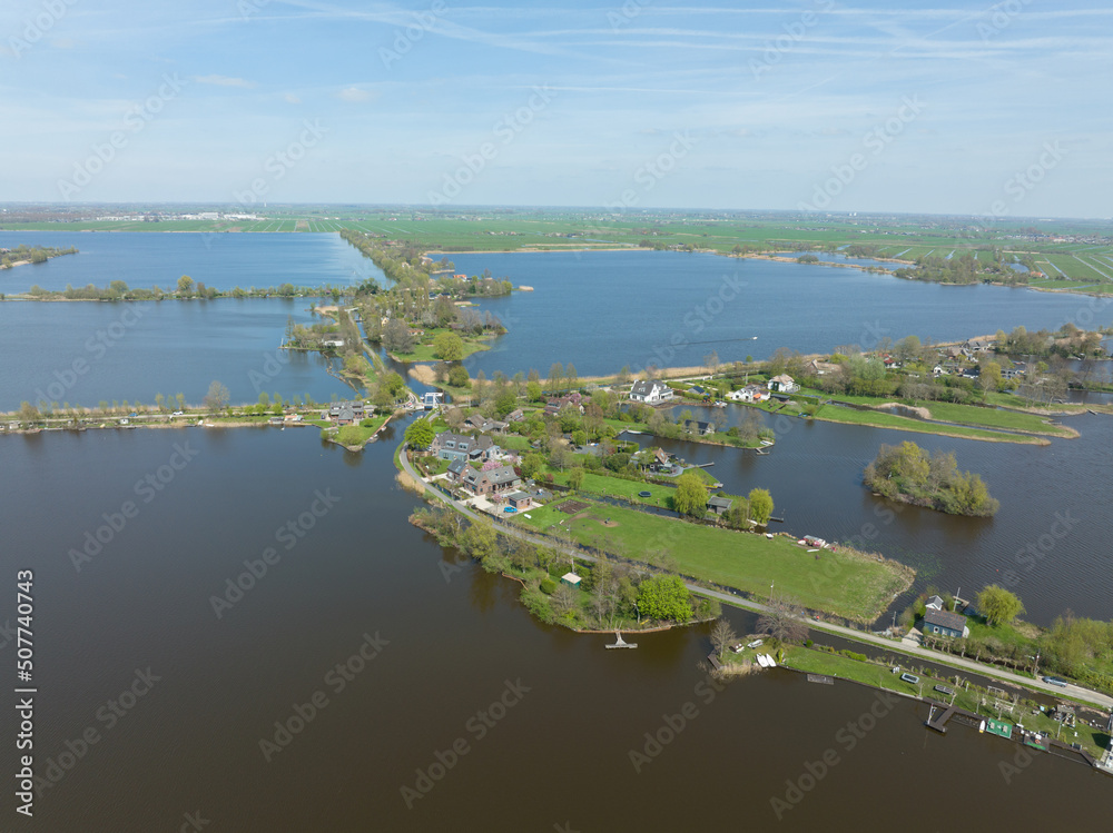 Typical dutch nature lake scenery at a sunny day. Reeuwijkse plannen in Holland. countryside natural outdoor lake river and green nature in spring. Recreation waterway scenic view.