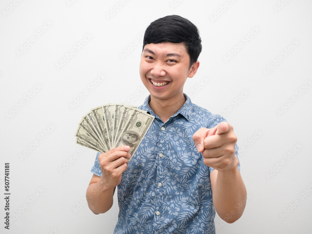 Man blue shirt smiling gesture point finger at you hold a lot of money Man blue shirt smiling gesture point finger at you hold a lot of money