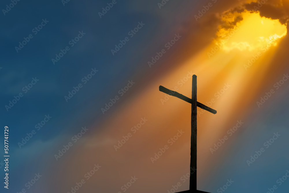 Christian cross over beautiful sunset background Christian cross over beautiful sunset background