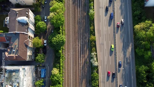 highway, train tracks, houses blocks.
Spectacular aerial view flight bird's eye view tilt up drone footage
of Berlin Friedenau Summer 2022. Cinematic view from above Tourist Guide by Philipp Marnitz photo