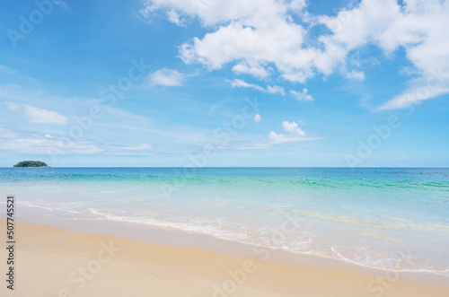 Tropical sandy beach with blue ocean and blue sky background image for nature background or summer background © panya99