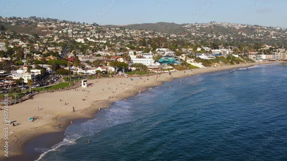 Aerial view of people enjoying a sunny day at Laguna beach, in California, USA - tracking, drone shot Aerial view of people enjoying a sunny day at Laguna beach, in California, USA - tracking, drone shot