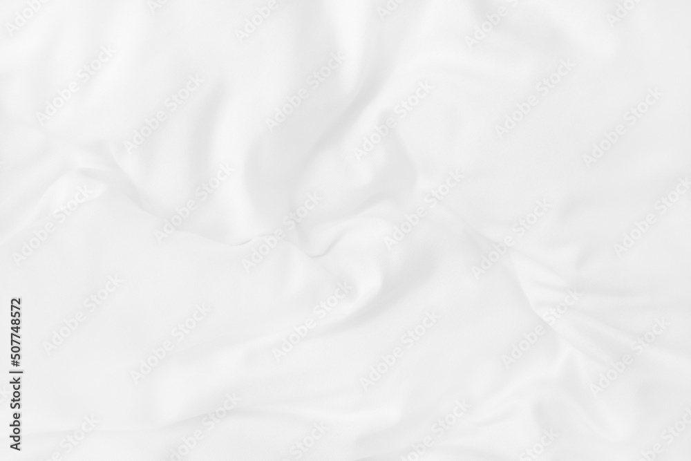 Texture of white blanket and bedding sheet with crumpled or messy in bedroom after wake up.