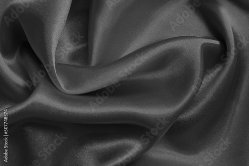 Dark grey fabric texture background, detail of silk or linen pattern.