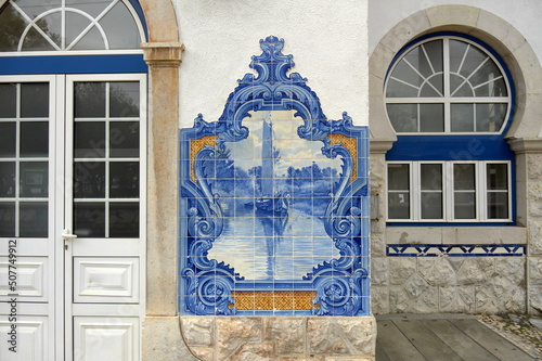 Portuguese Azulejos tiles, depicting typical regional scenes and monument on the facade of Santarem station, Portugal