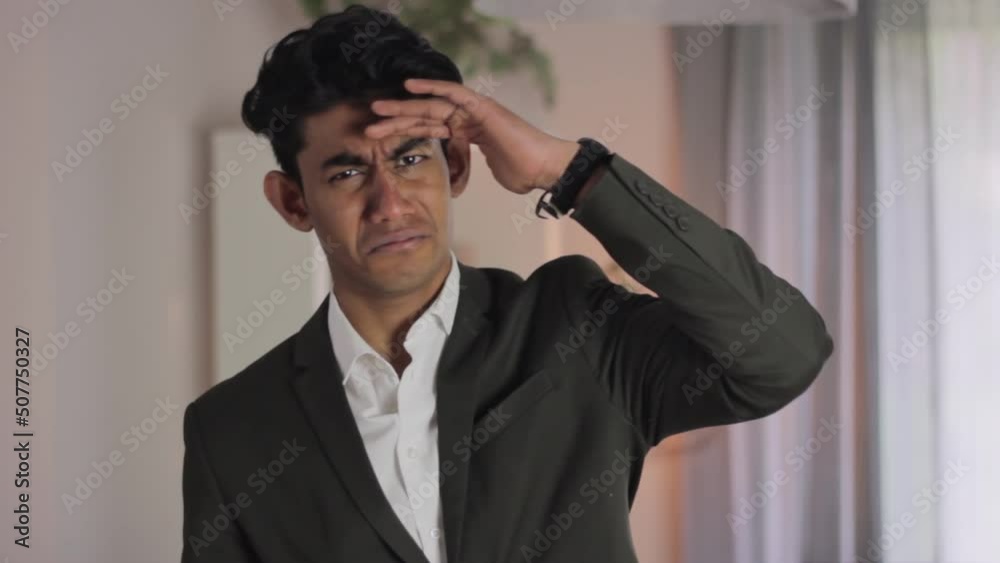 Asian Man Dressed Formal Wondering, Frown, Puts on Glasses to See Better