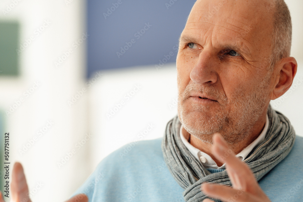 Senior businessman gesturing in office Senior businessman gesturing in office