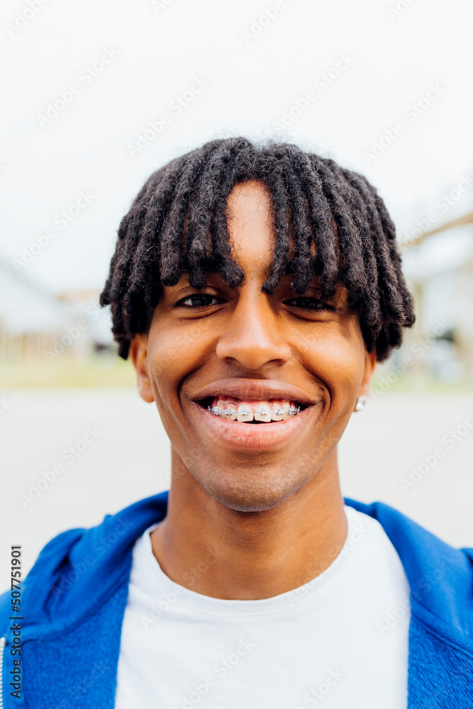 Happy young man with dental braces Happy young man with dental braces