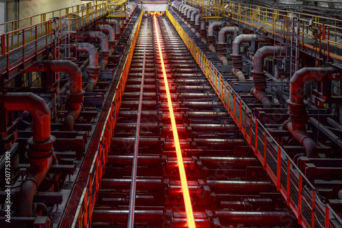 Hot steell billet on rolling mill.