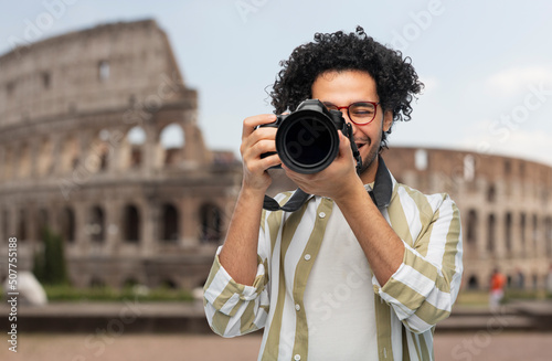 Canvas Print travel, tourism and photography concept - happy smiling man or photographer in g