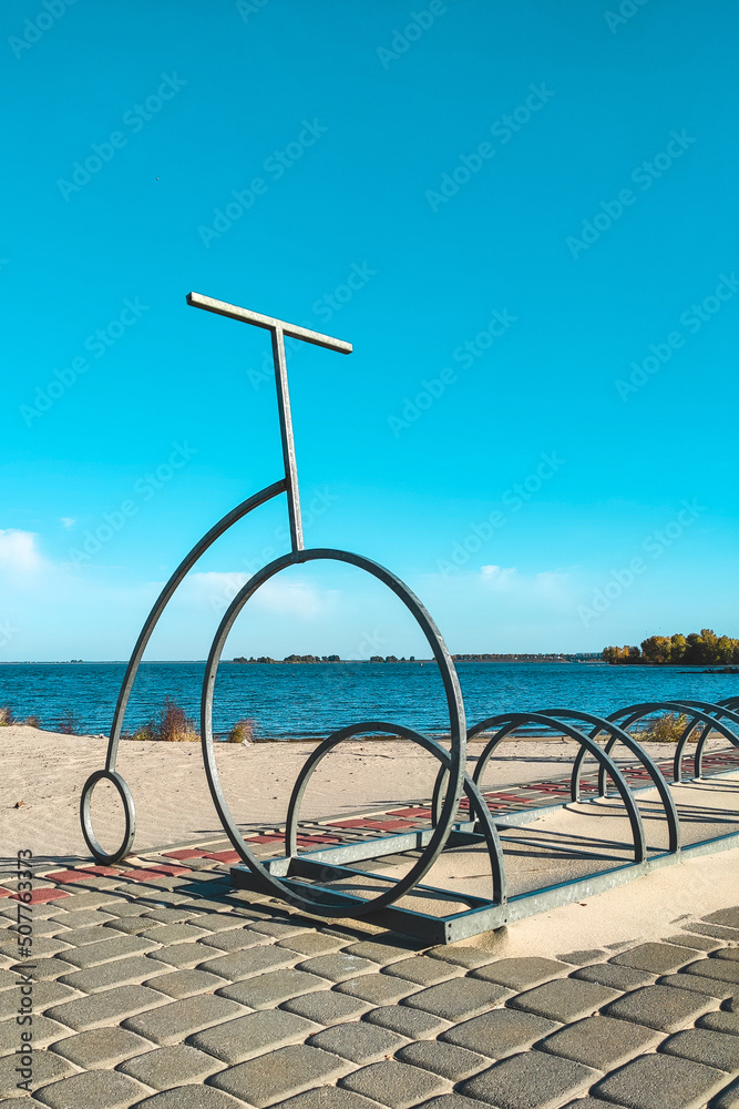 Author's parking lot in the form of Penny Farting for bicycles on the beach. Author's parking lot in the form of Penny Farting for bicycles on the beach.