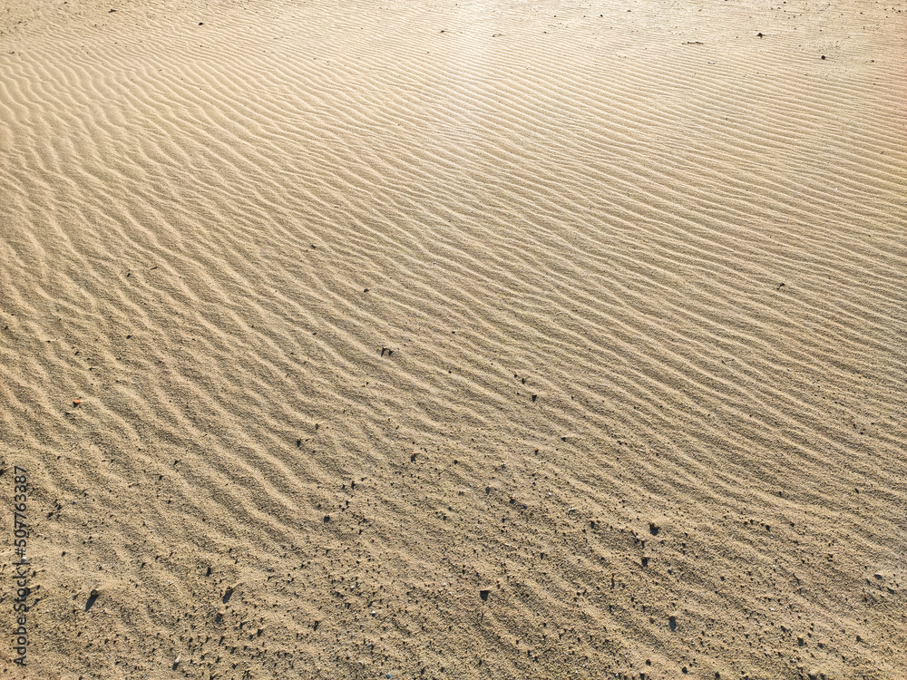 Embossed texture of sand on the beach, grit close up. Embossed texture of sand on the beach, grit close up.