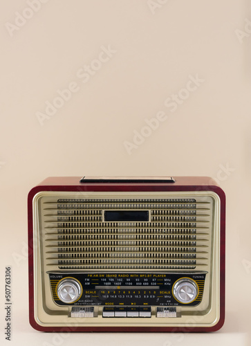Antique radio isolated on beige background with copy space