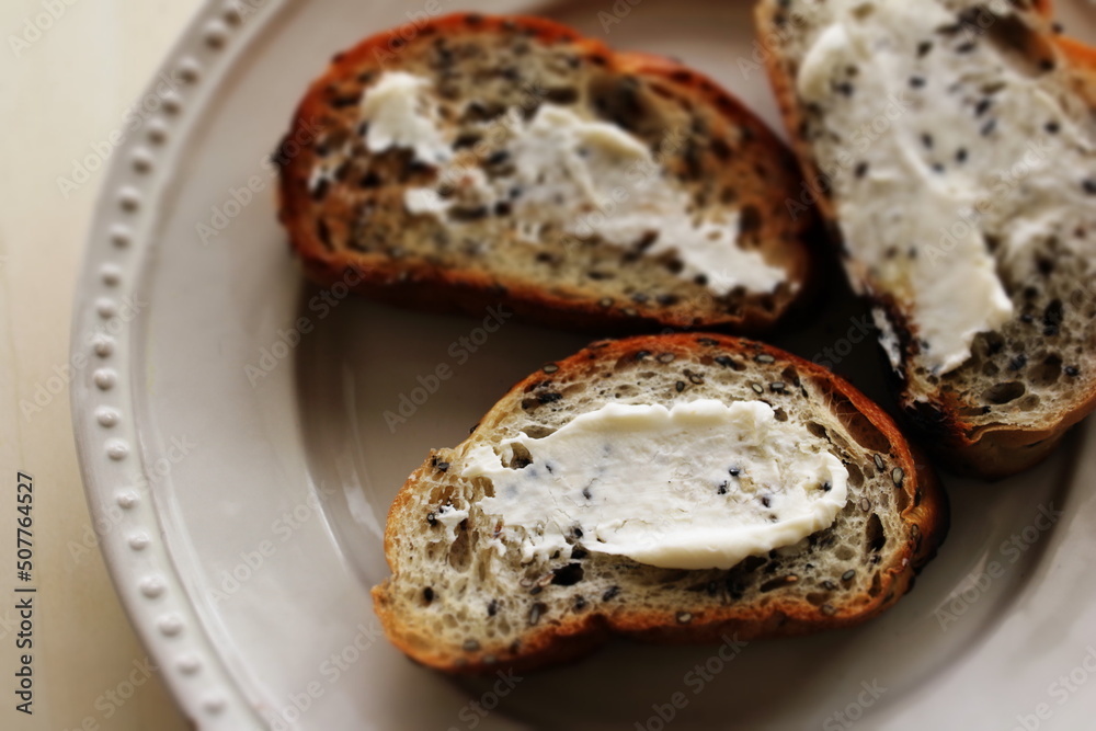 Sliced sesame French bread with cream cheese