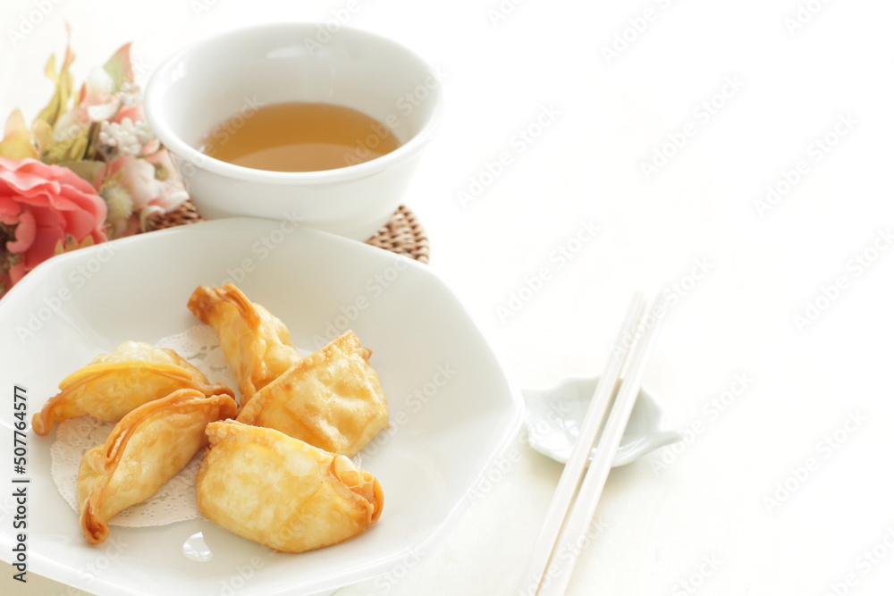 Chinese dumpling, deep fried, jiaozi on plate for yum cha food image Chinese dumpling, deep fried, jiaozi on plate for yum cha food image