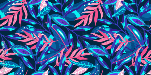 Neon tropic floral seamless pattern on dark background. Floral neon for bright summer design. Tropic jungle in abstract style on purple background