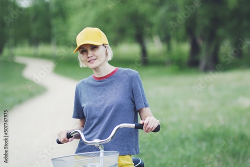 happy woman on a bike ride in the park