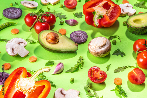 Various fresh vegetables pattern. Raw organic vegetables, salad ingredients bright flatlay on light green background. Healthy diet common diet, vegan vegetarian foodcooking background copy space photo