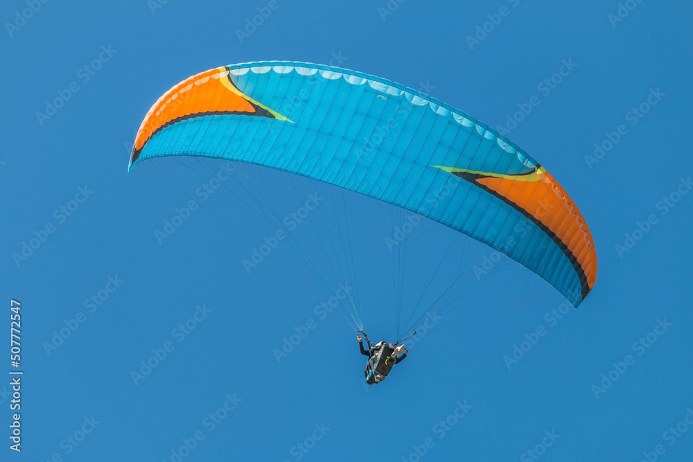 Twin paraglider. Paragliding against the blue sky. Twin paraglider. Paragliding against the blue sky.