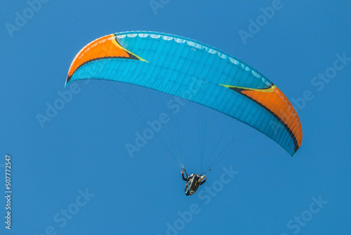 Twin paraglider. Paragliding against the blue sky.