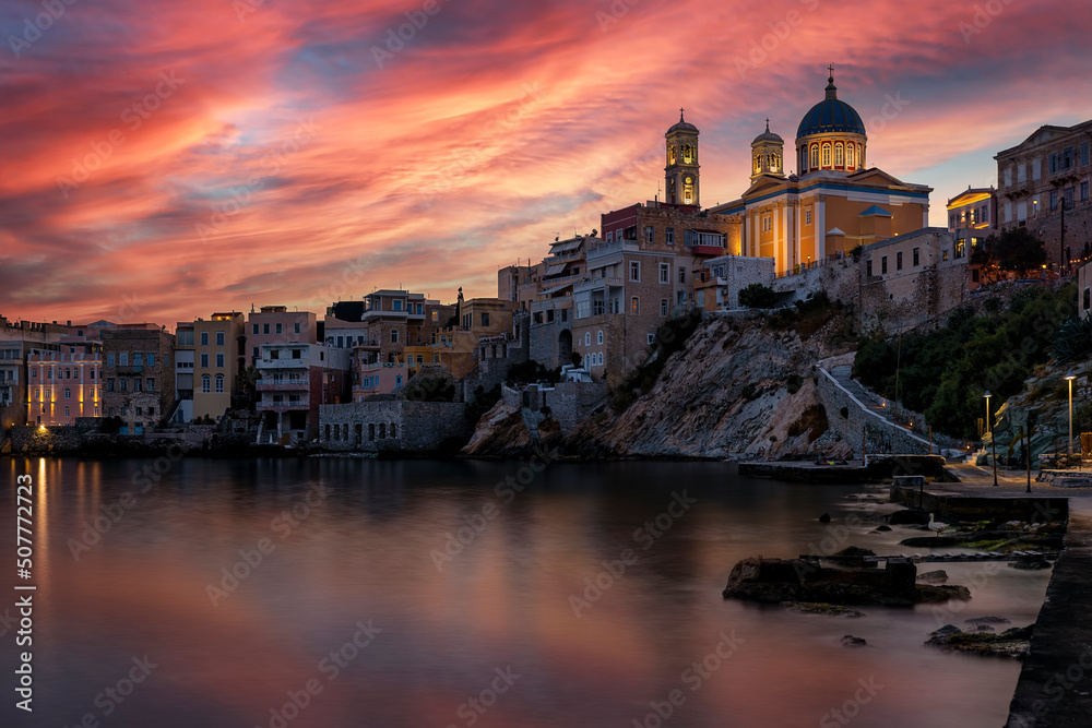The beautiful Vaporia district of Ermoupoli town on Syros island, Cyclades, Greece, during a colorful dusk