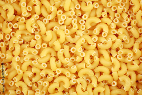 Macaroni pasta closeup background or wallpaper photo