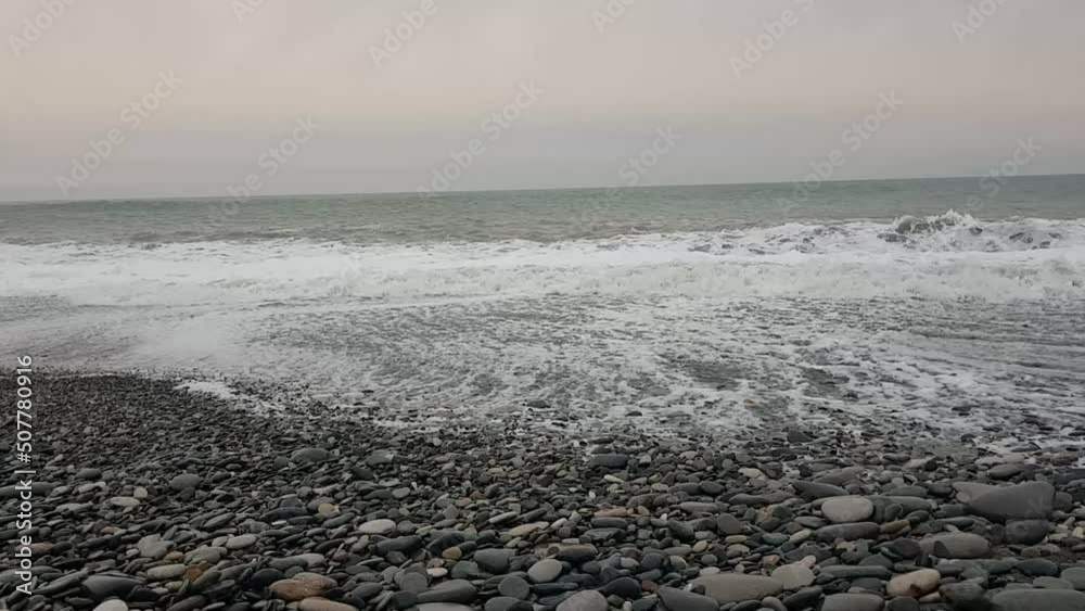 Evening scene with gray sky on the sea. Waves on the sea Evening scene with gray sky on the sea. Waves on the sea