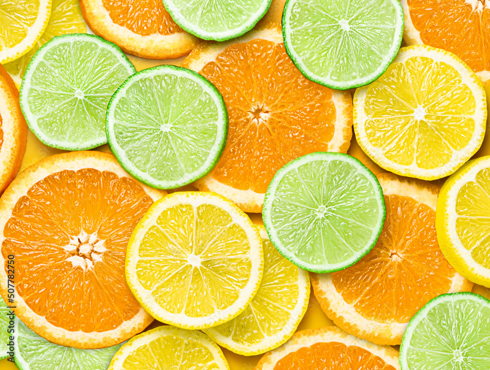 Obraz premium background of sliced orange lemon and lime slices